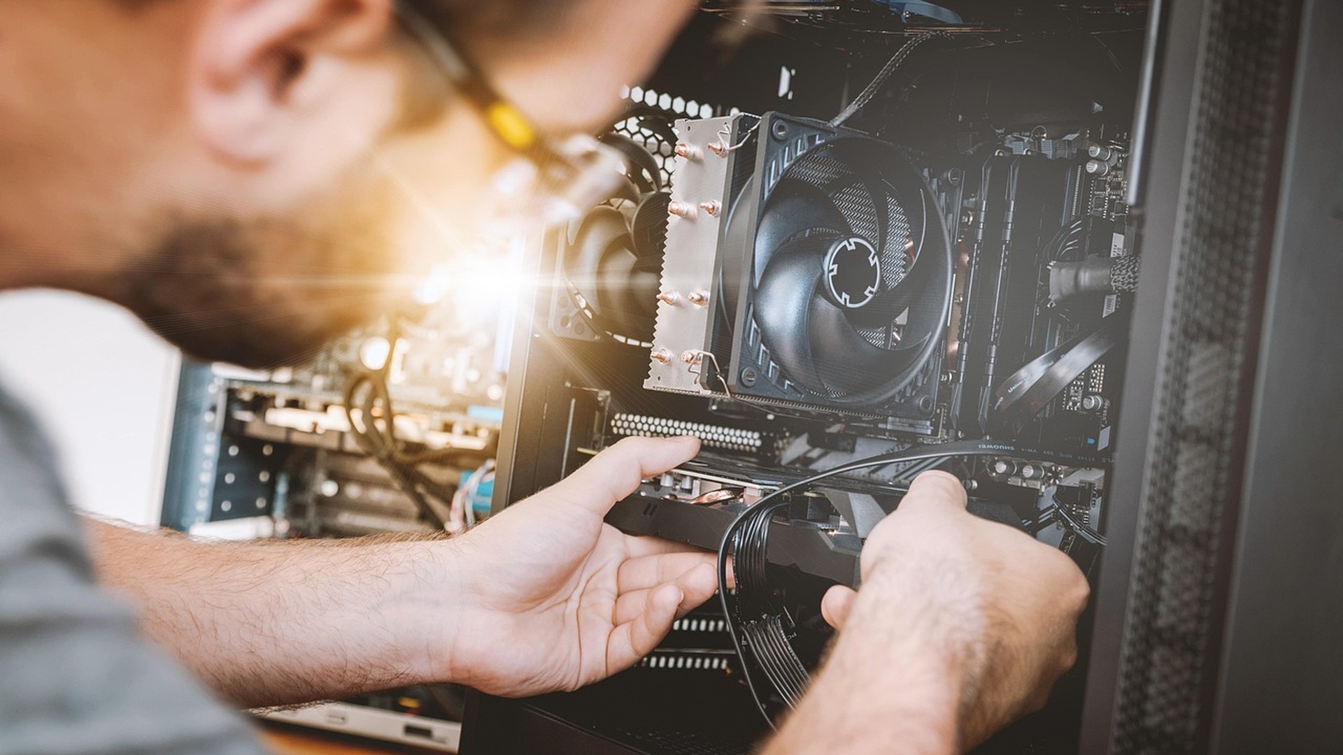 Technician hands repairing a laptop motherboard