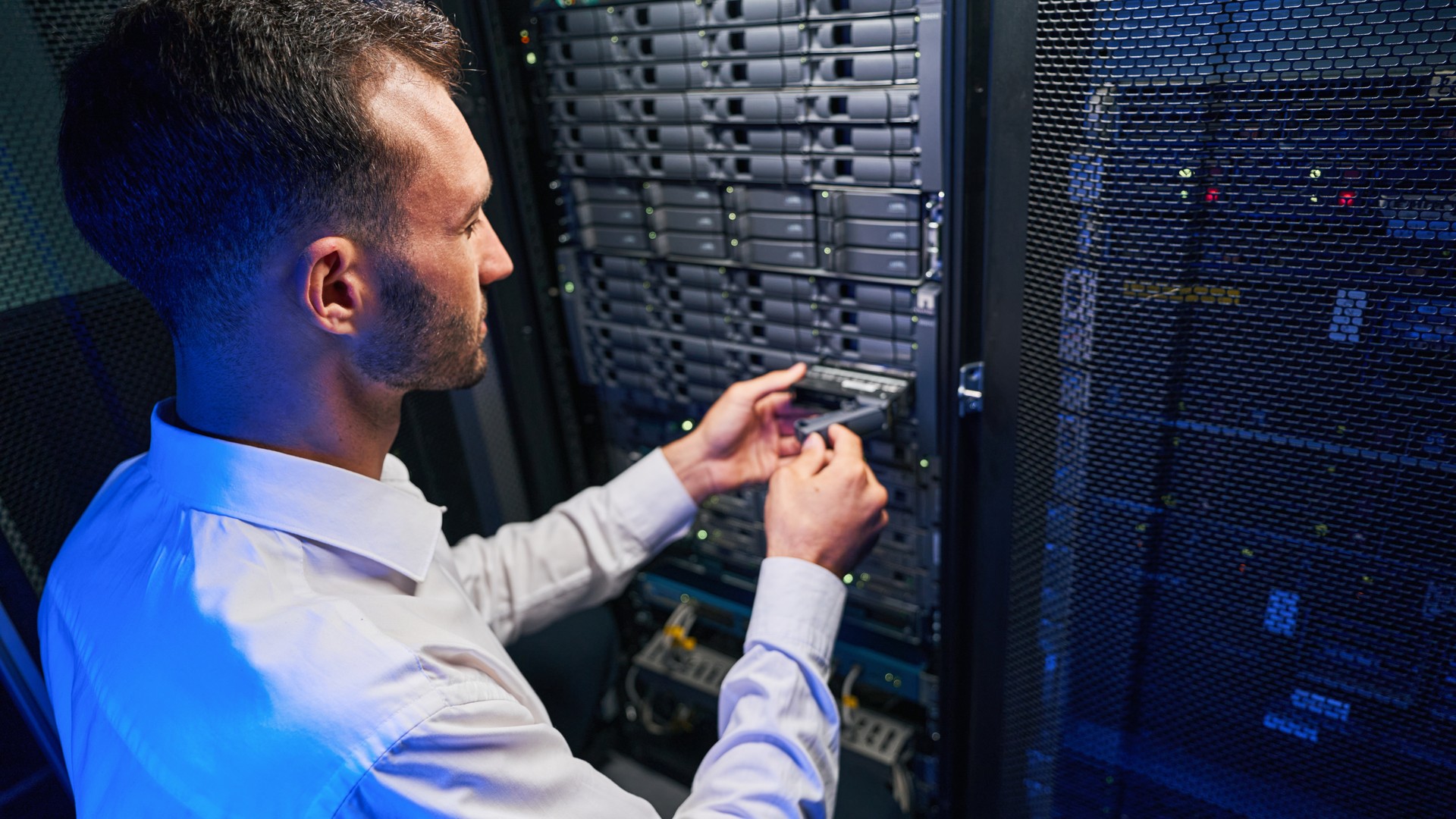 Technician working on server hardware for cloud infrastructure security