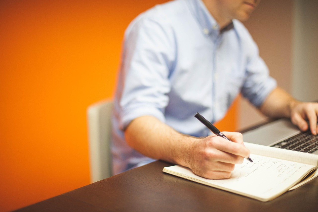 Business owner working late on a laptop in a dimly lit office
