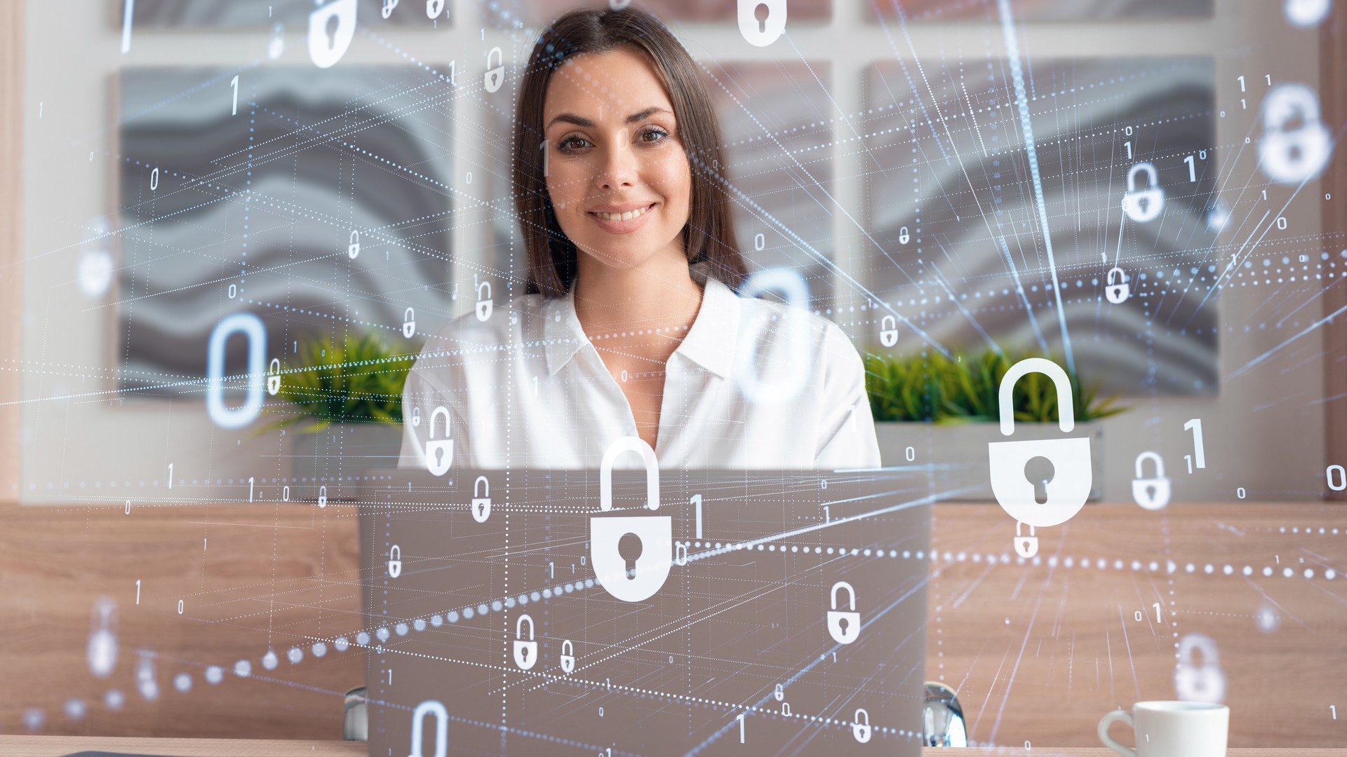 Person behind a laptop with overlaid padlocks, binary digits and connecting lines.